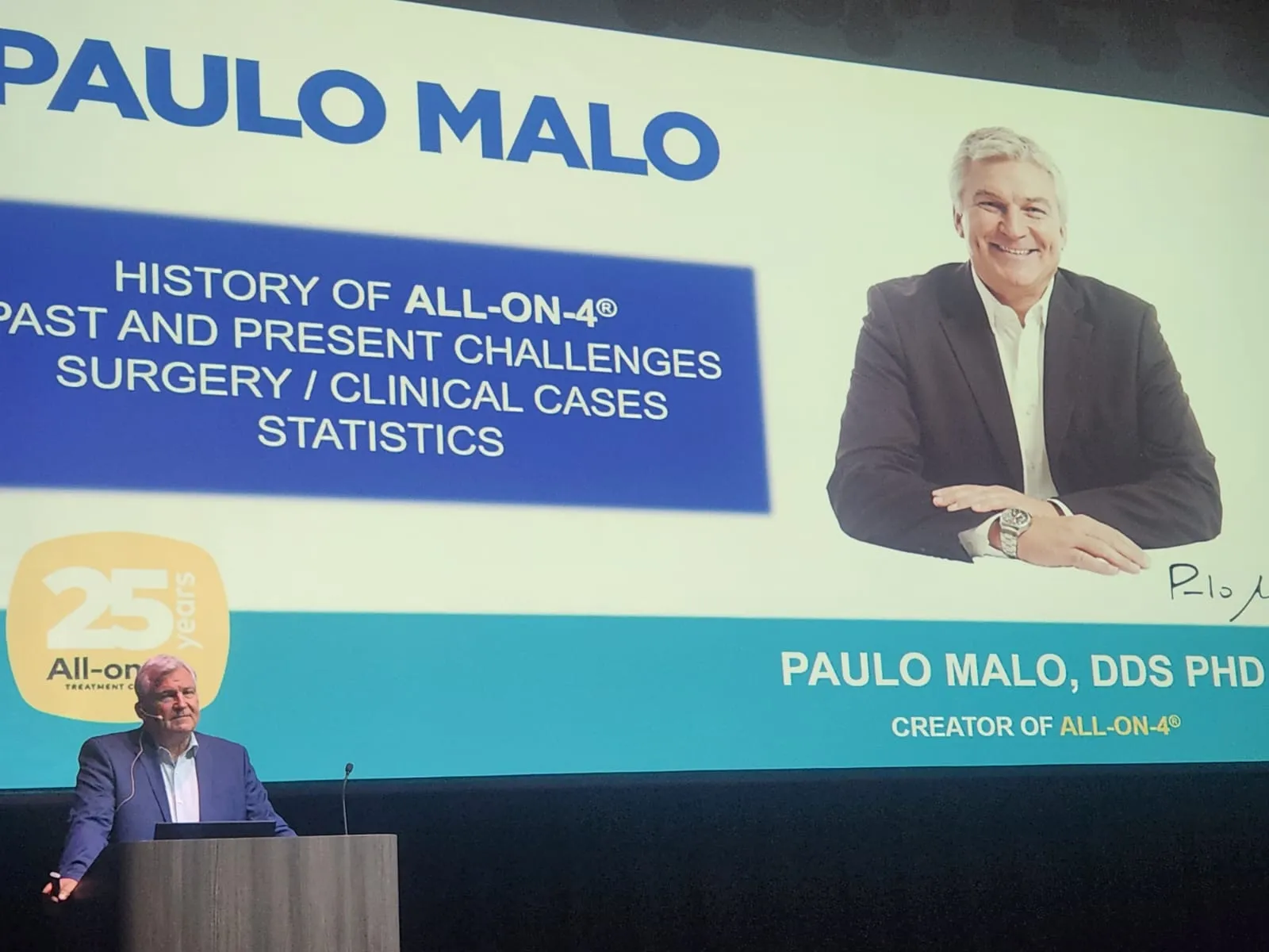 Dr. Paulo Malo, creator of All-on-4, lecturing at the All on X Global Congress, January 2026, where Dr. Nabeel met and was photographed with him.